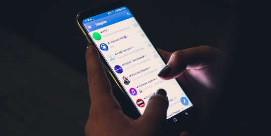 person using telegram app